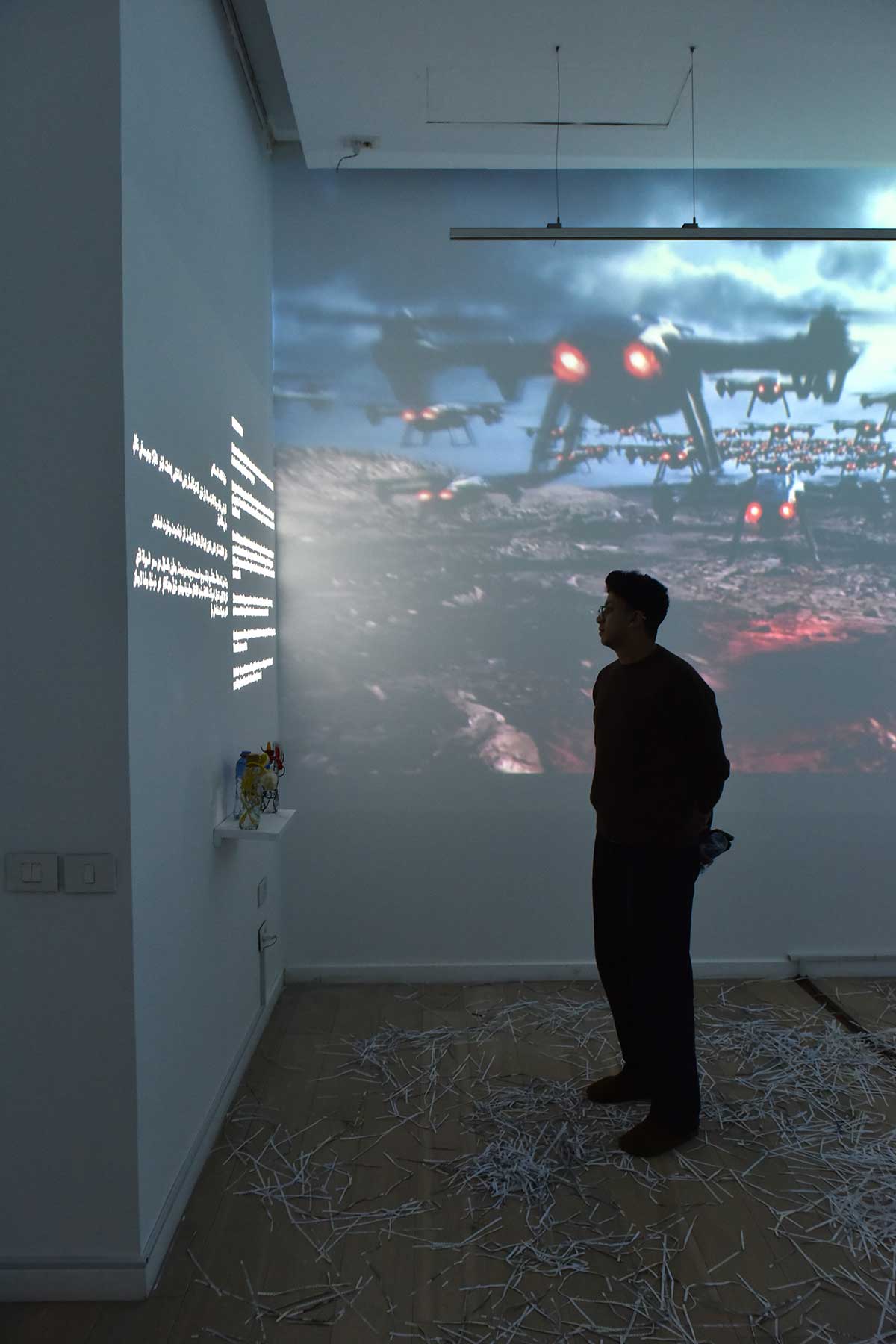 A person observes art on a wall