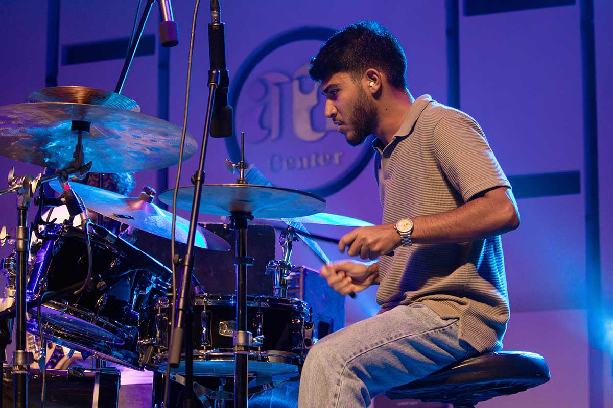 David Maged plays the drums