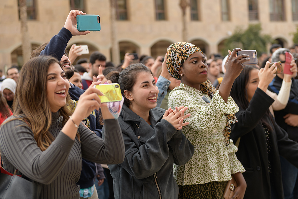 AUC international students taking pictures while on campus. 