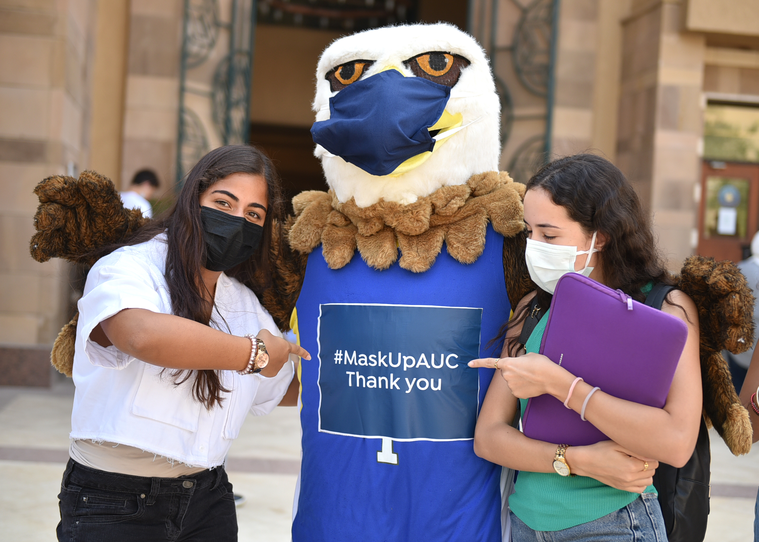 students with auc mascot