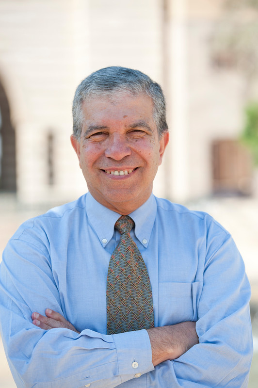 Smiling man with crossed hands