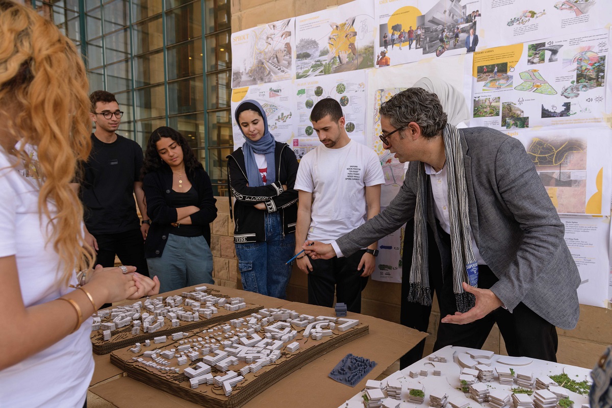 Professor explaining about buildings to students