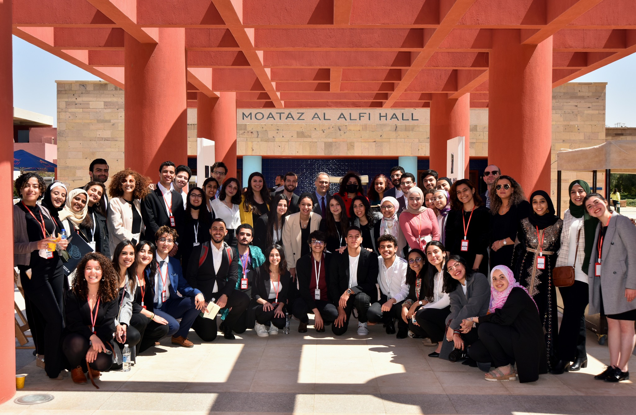 A group photo of TL students and staff with AUC President