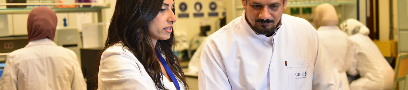 a girl and a boy in a research lab