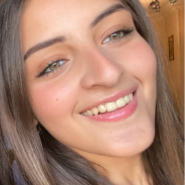 Face of a girl with green eyes smiling