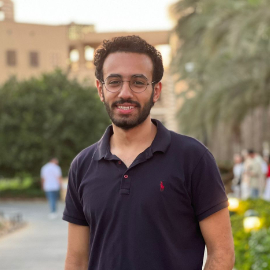 Boy with glasses smiling