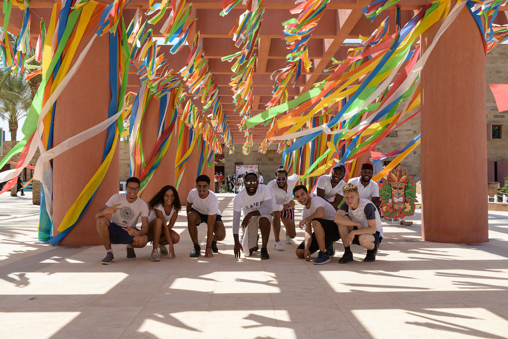 Group of diverse students with streamers over their heads