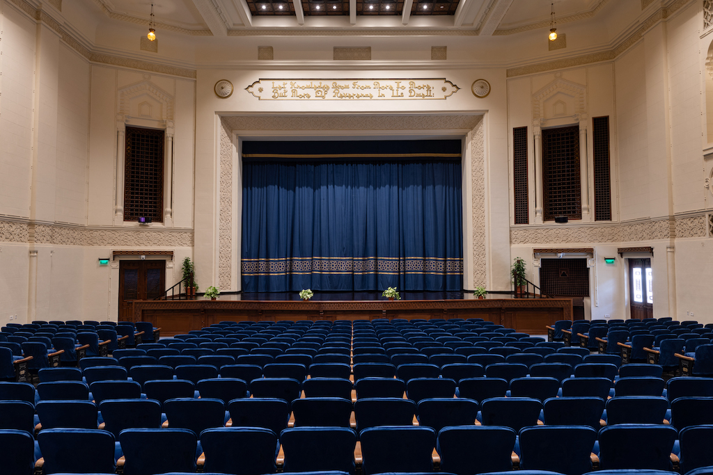 Ewart Hall with its stage and blue curtains