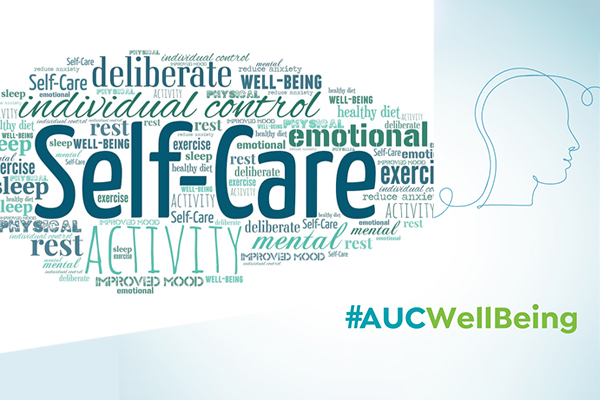 A word cloud with Self-Care in the middle and hash tag AUC Well Being on a pale blue background
