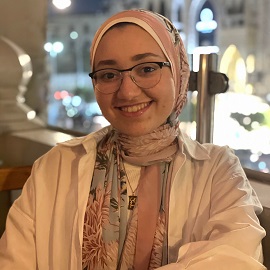 veiled girl with glasses smiling