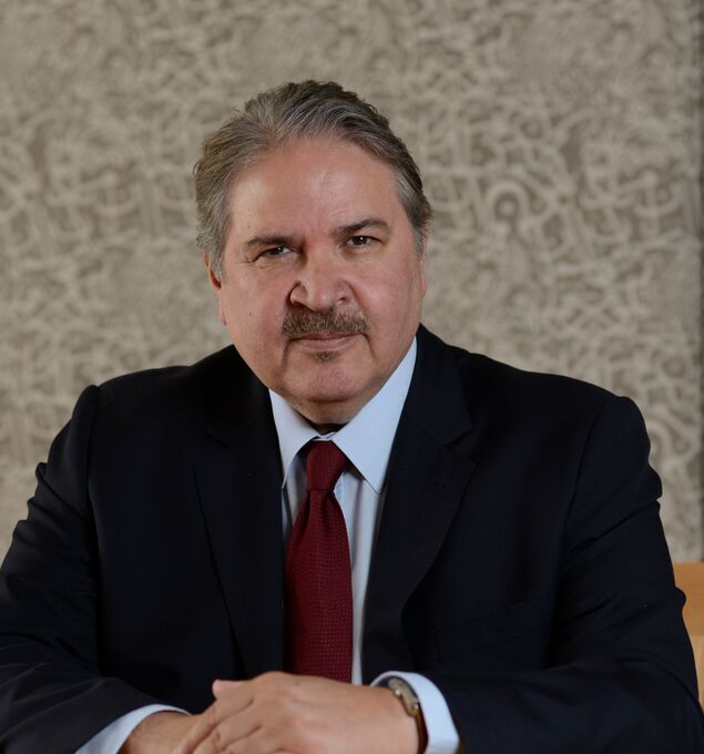 Man with suit and tie smiling