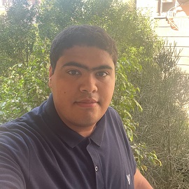 Boy wearing a black polo shirt