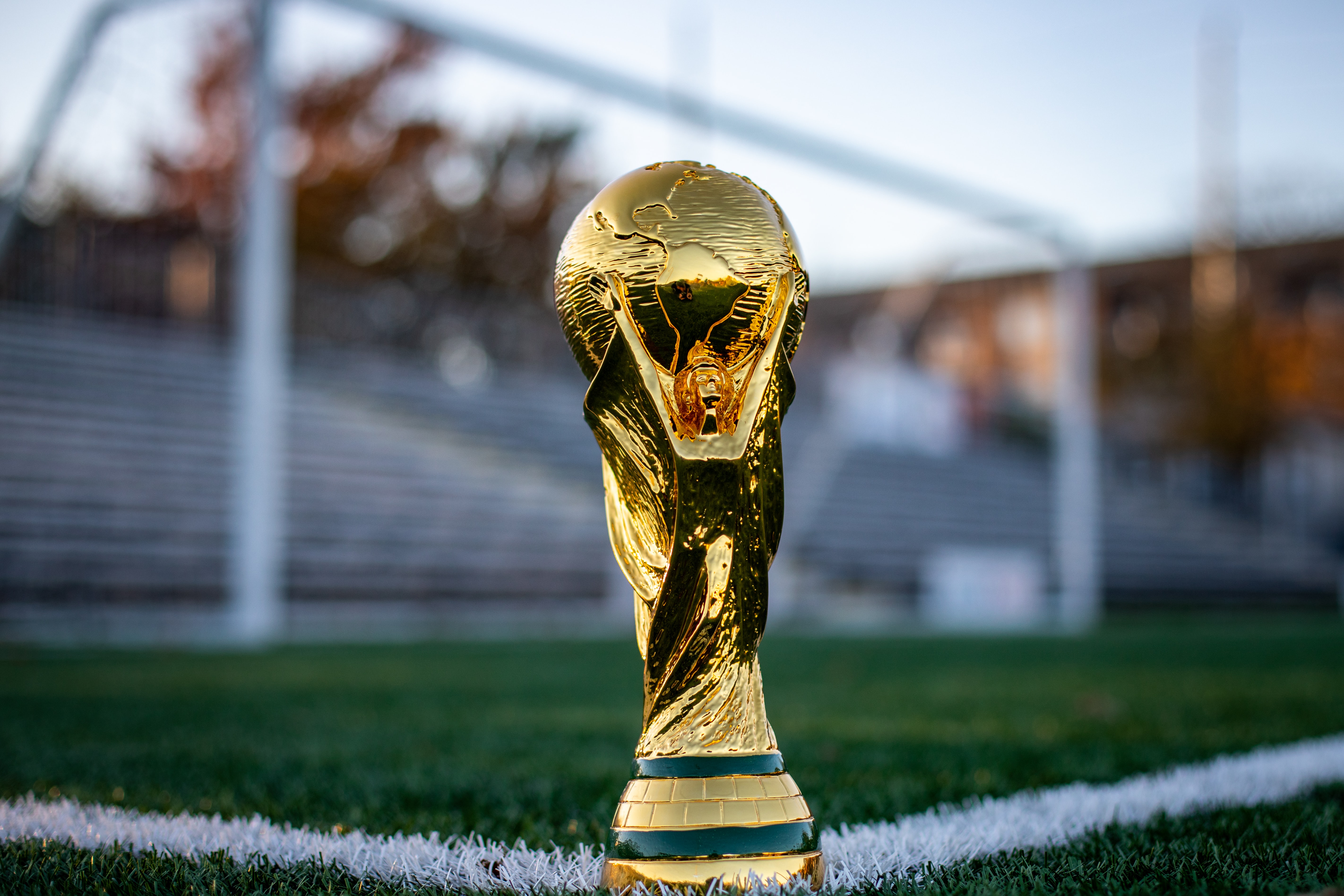 World cup trophy on a football field