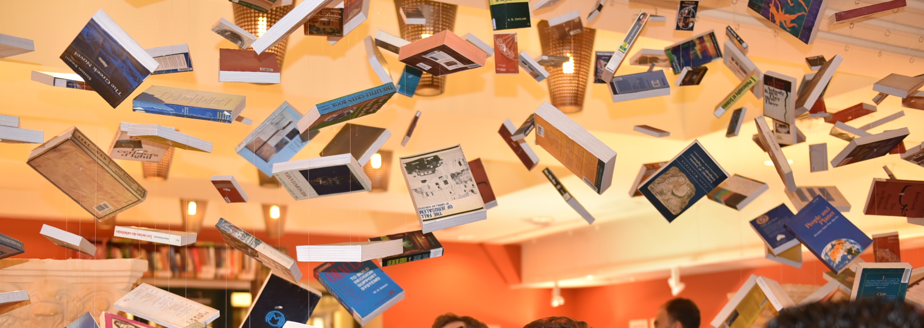 Al-Mutannabbi Street exhibition at the Rare Books and Special Collections Library in 2014 with books suspended in the air.