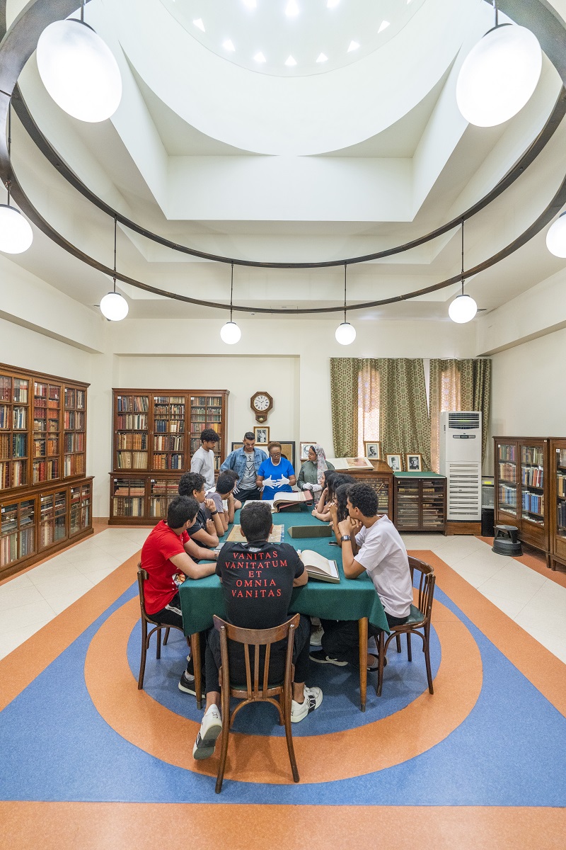 Group people sitting in a library