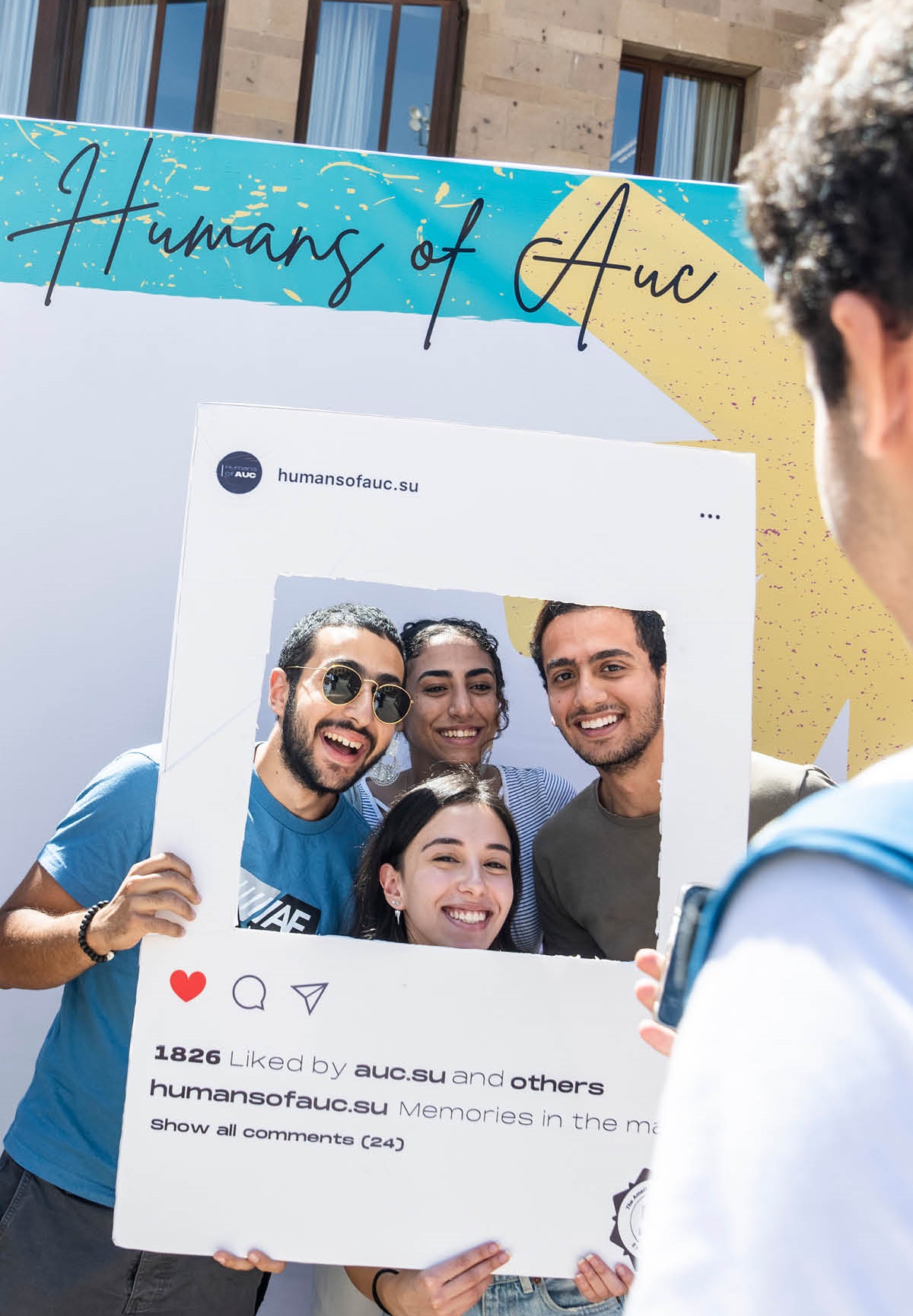 auc students smiling in a ID card frame