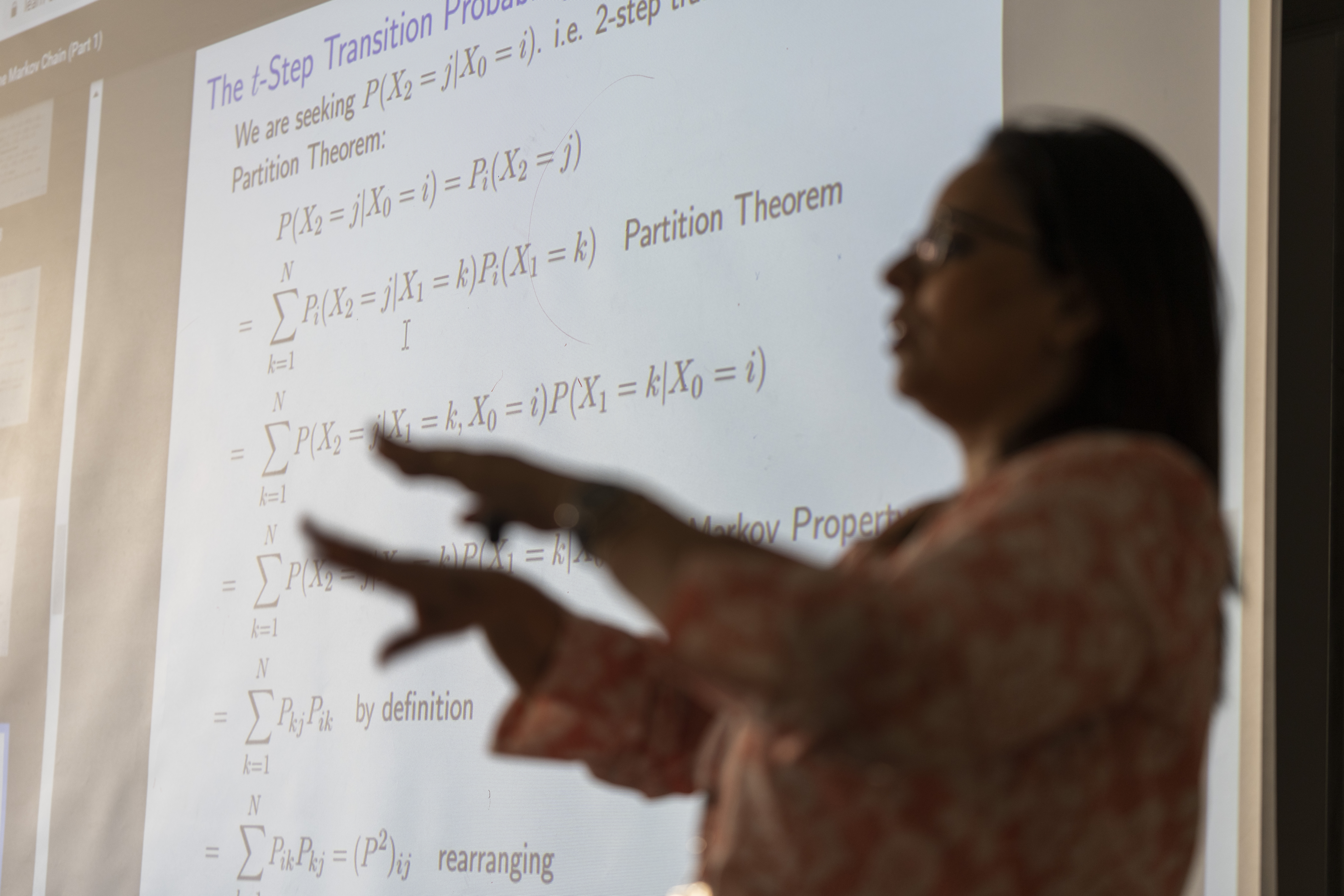 Faculty explaining equations in classroom