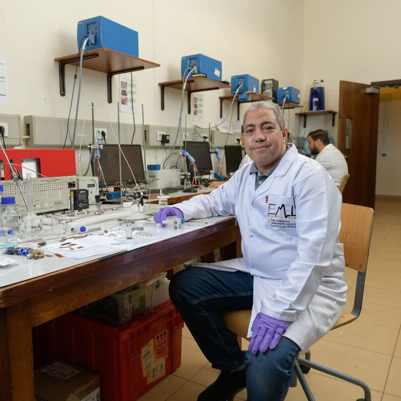 A scientist sitting in a lab