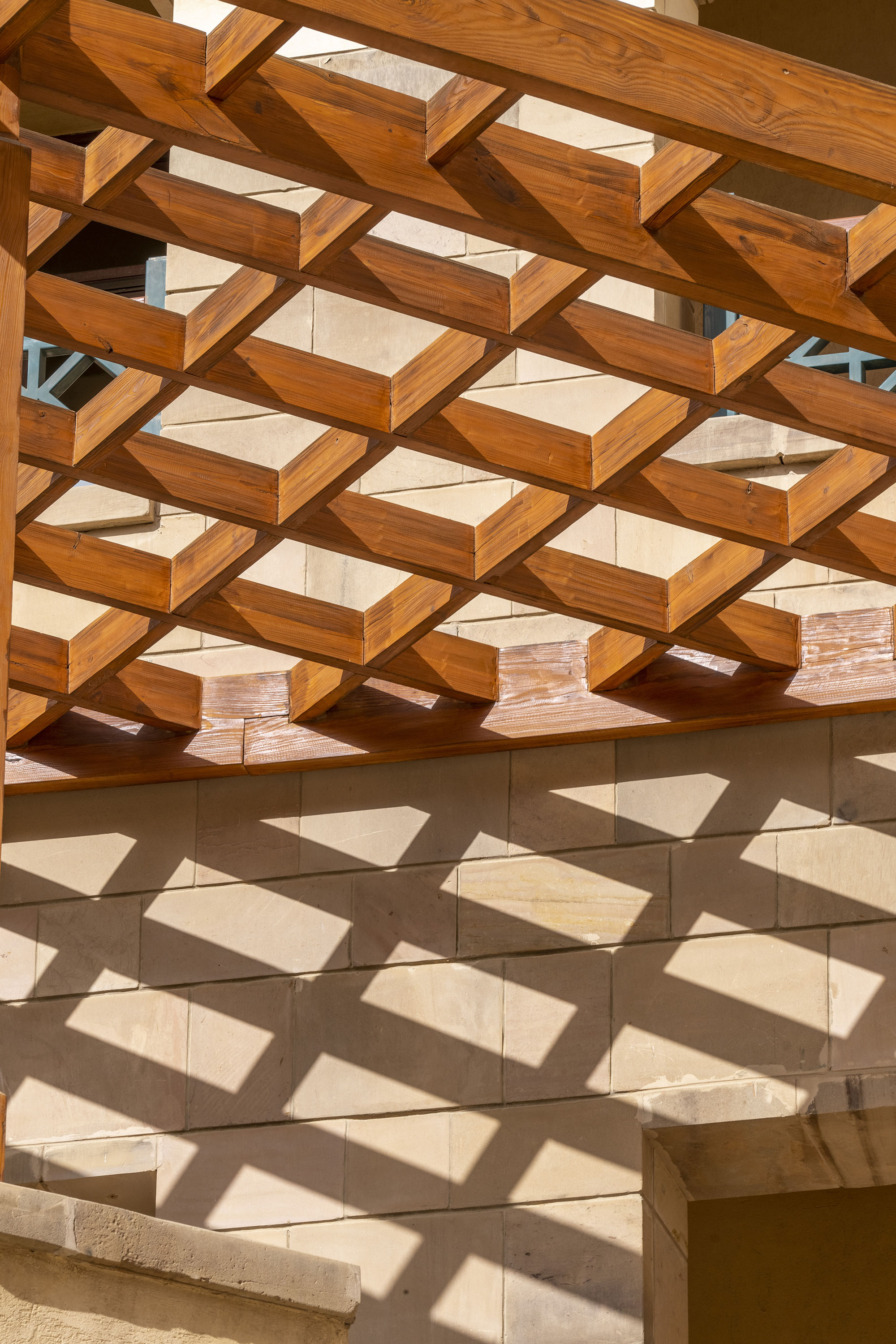 A wooden structure with a shadow on the wall