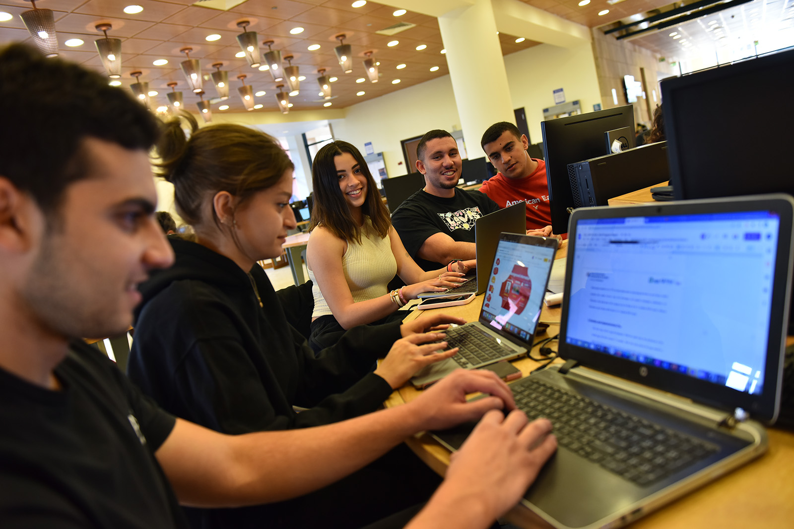 Students on their laptop in library