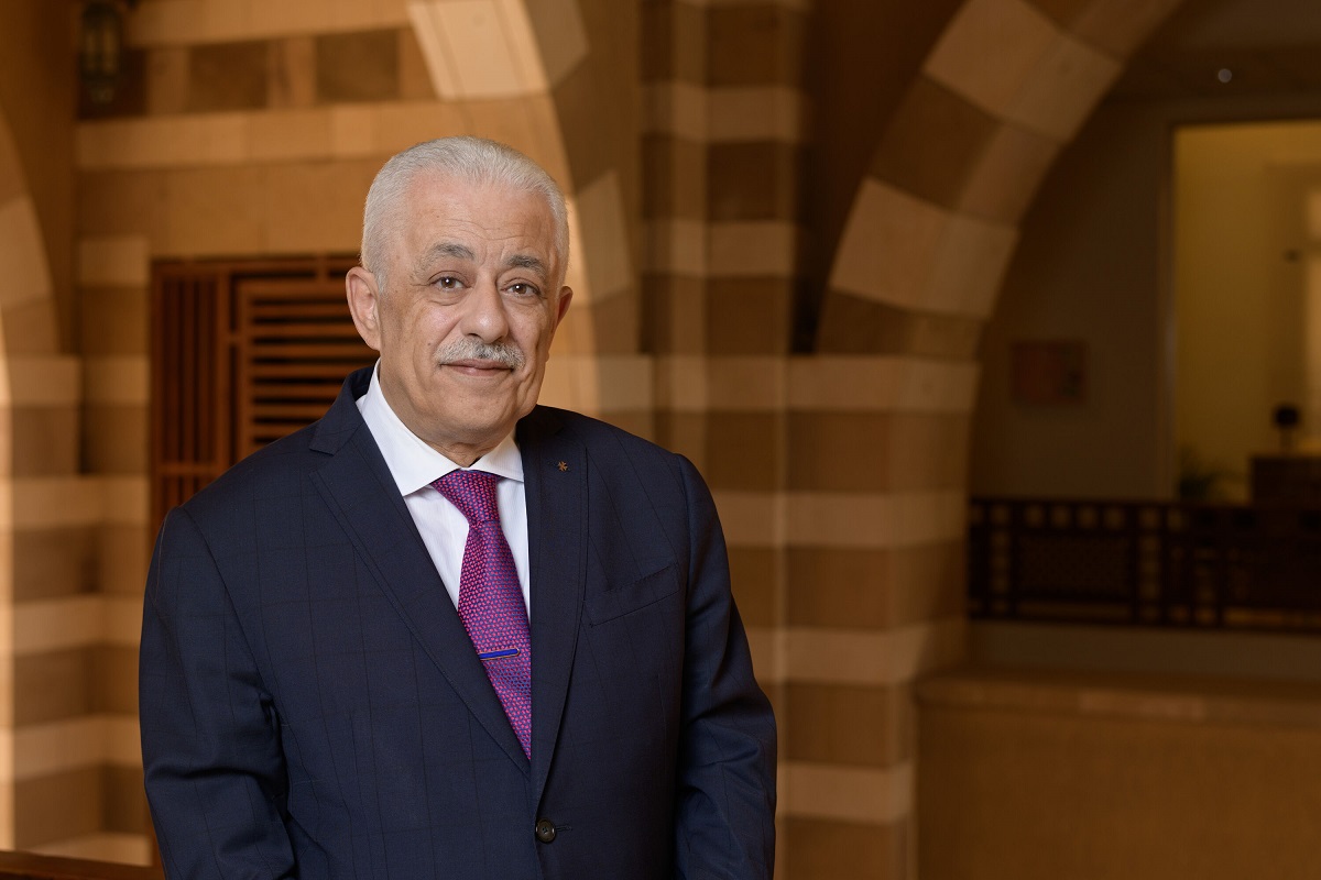 Man with suit and tie smiling