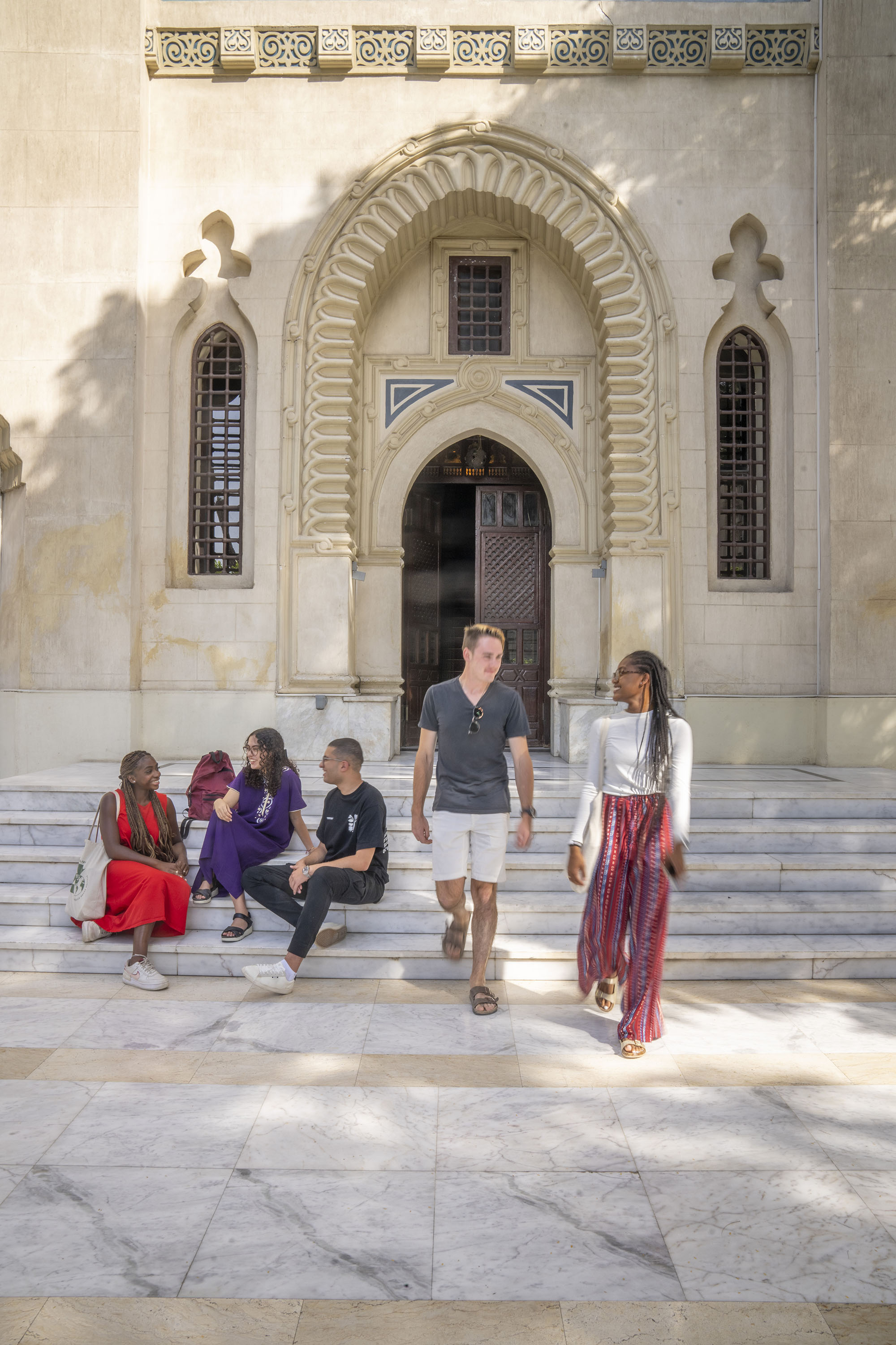 Inclusive and Comparative Education banner image of international students walking in front of a historic site