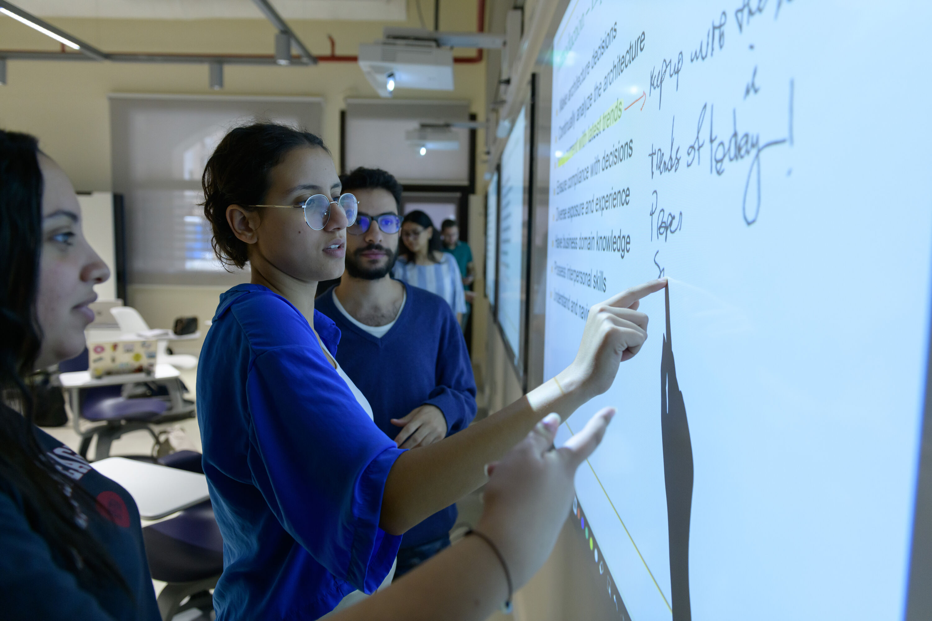 Public administration program image of student explaining on white board information