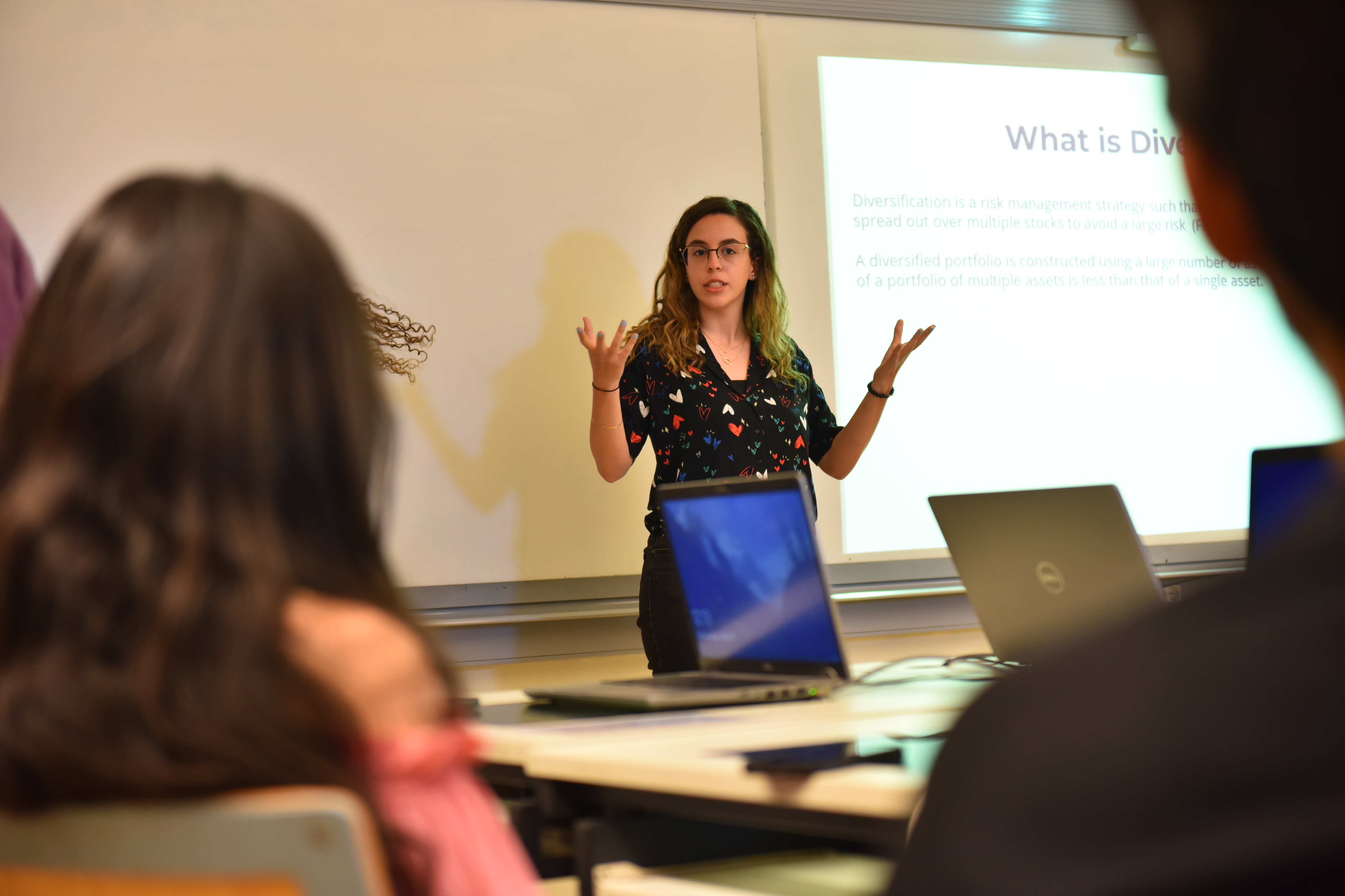 public policy program image of female student in front of class making a presentation