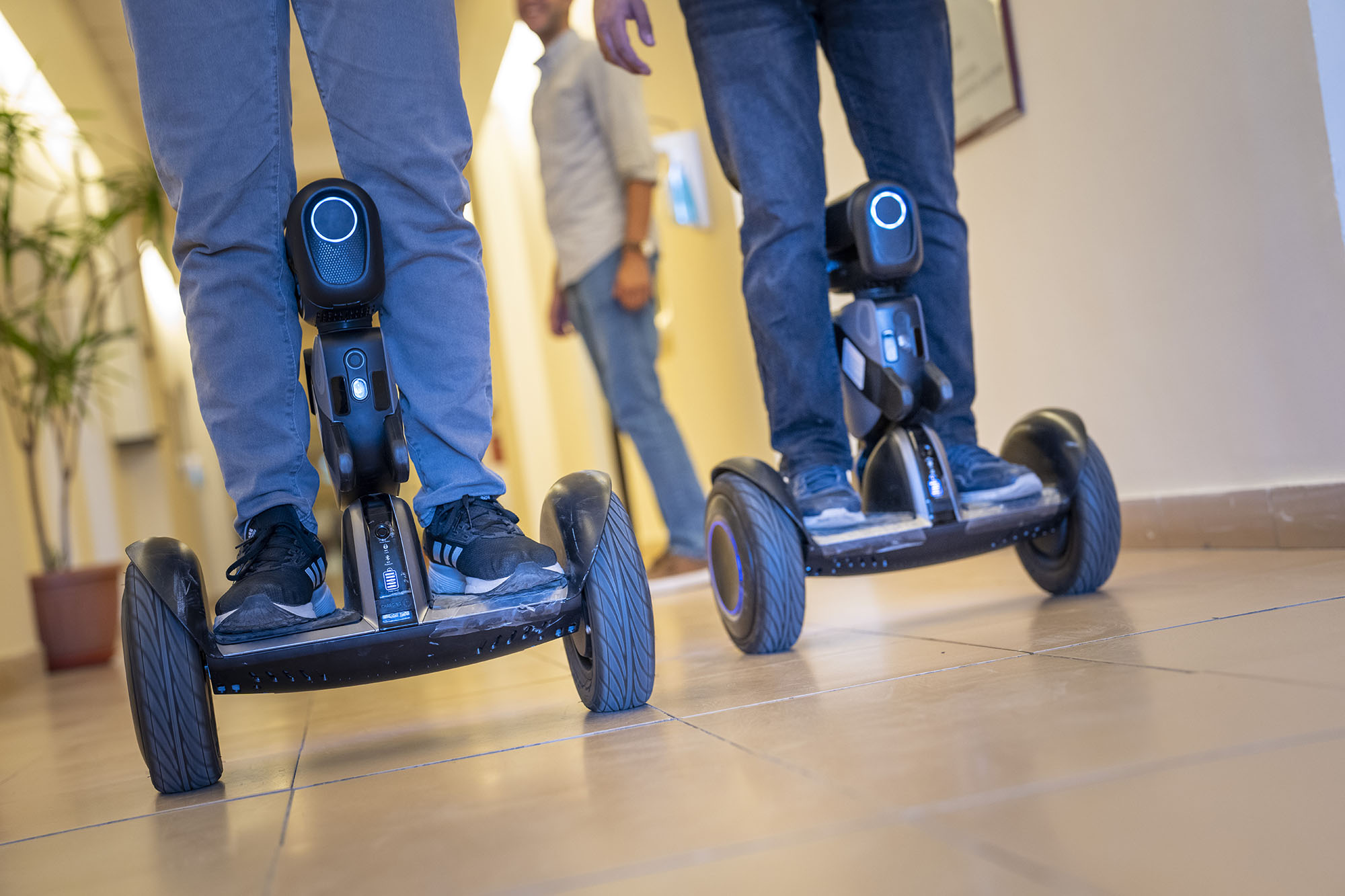 students testing a set of robots with wheels