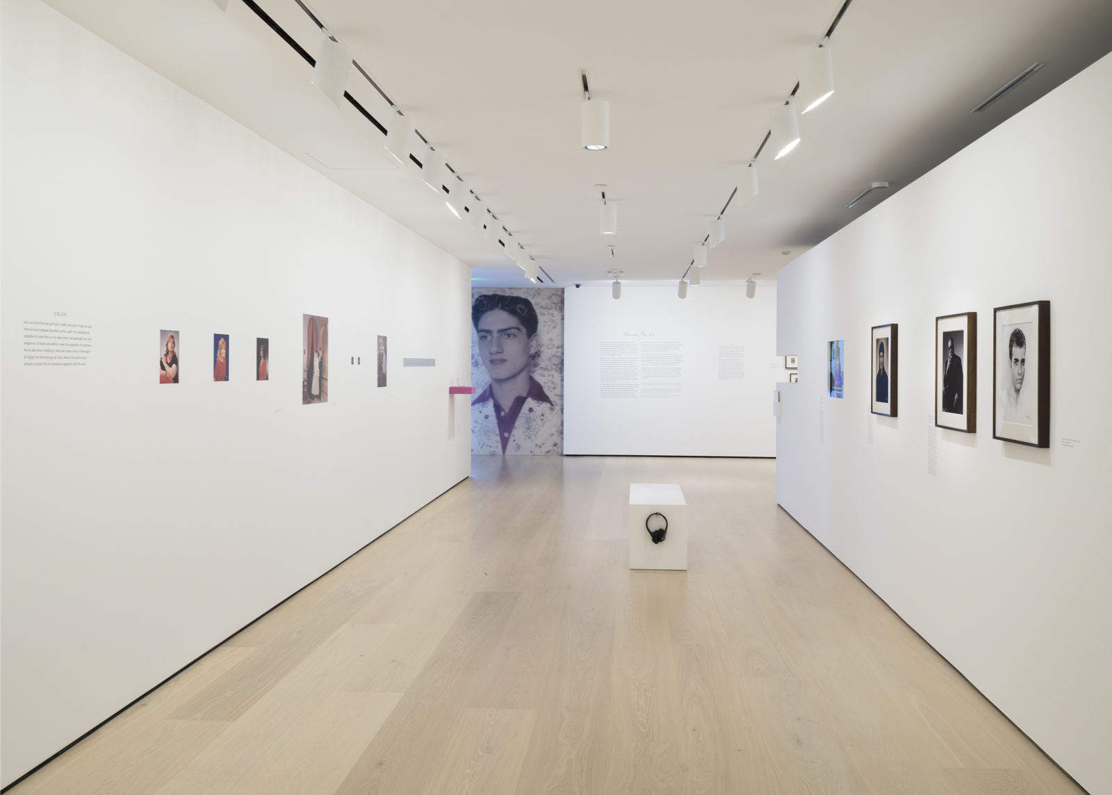 Inside of the Hammer Museum, displaying photographs taken by Van Leo on white walls