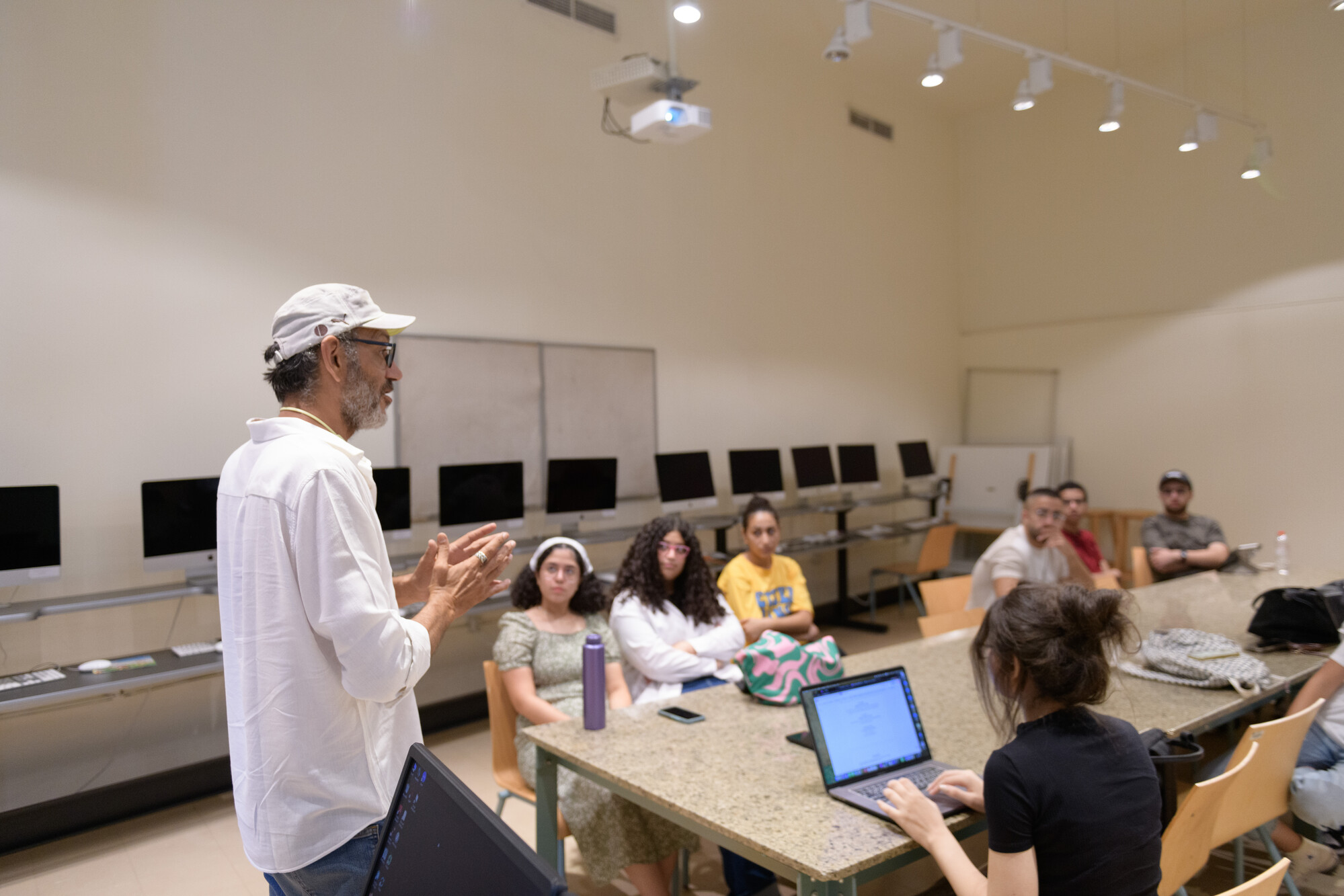A man teaching students in class