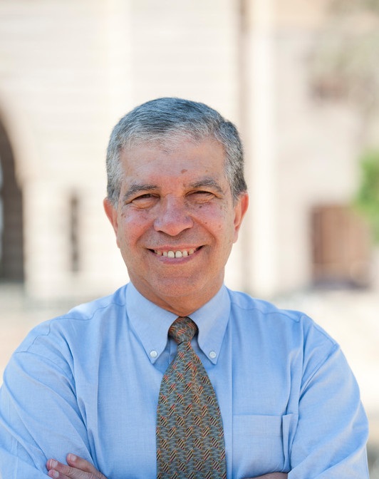 Smiling man with crossed hands