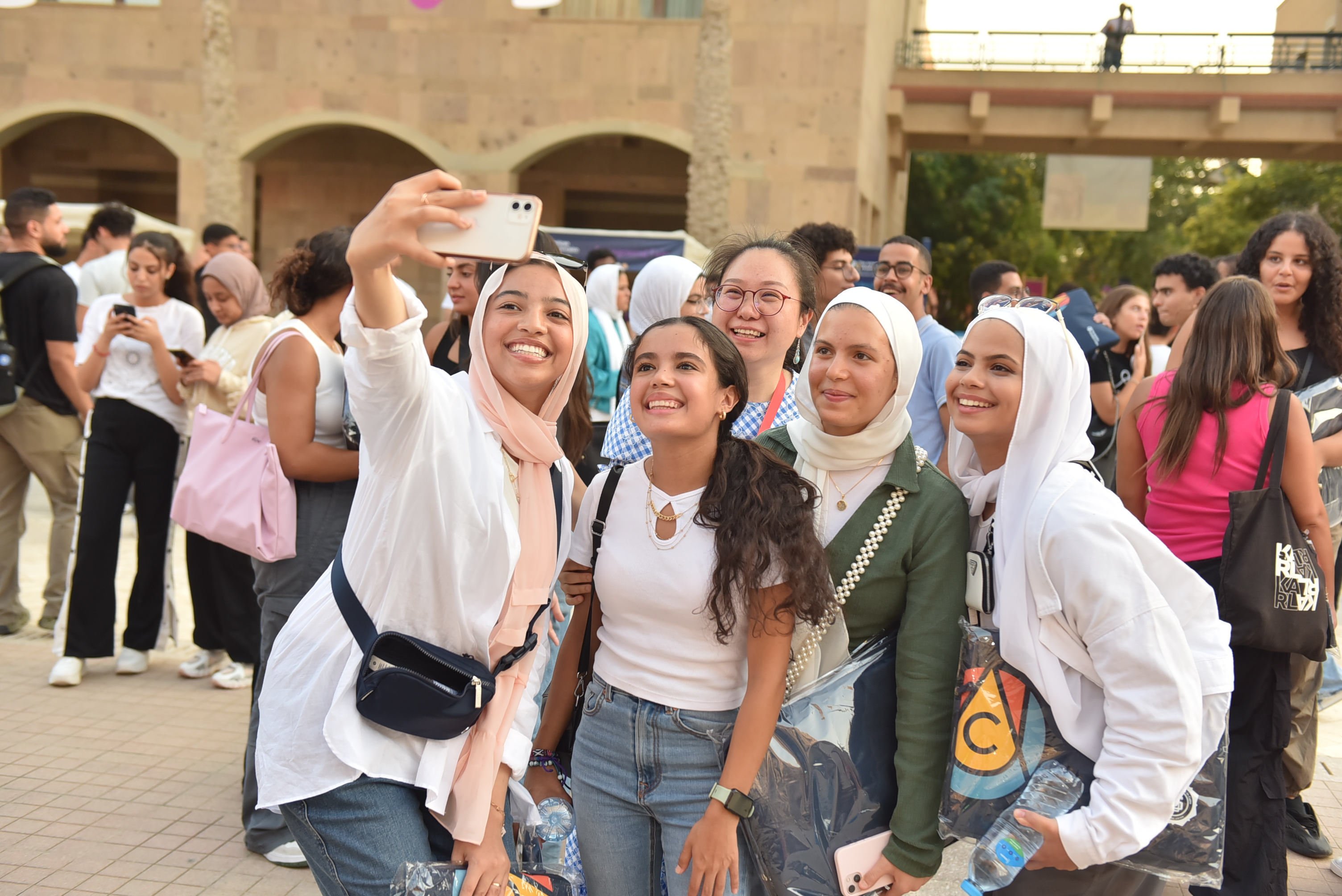 Girls taking a selfie on campus