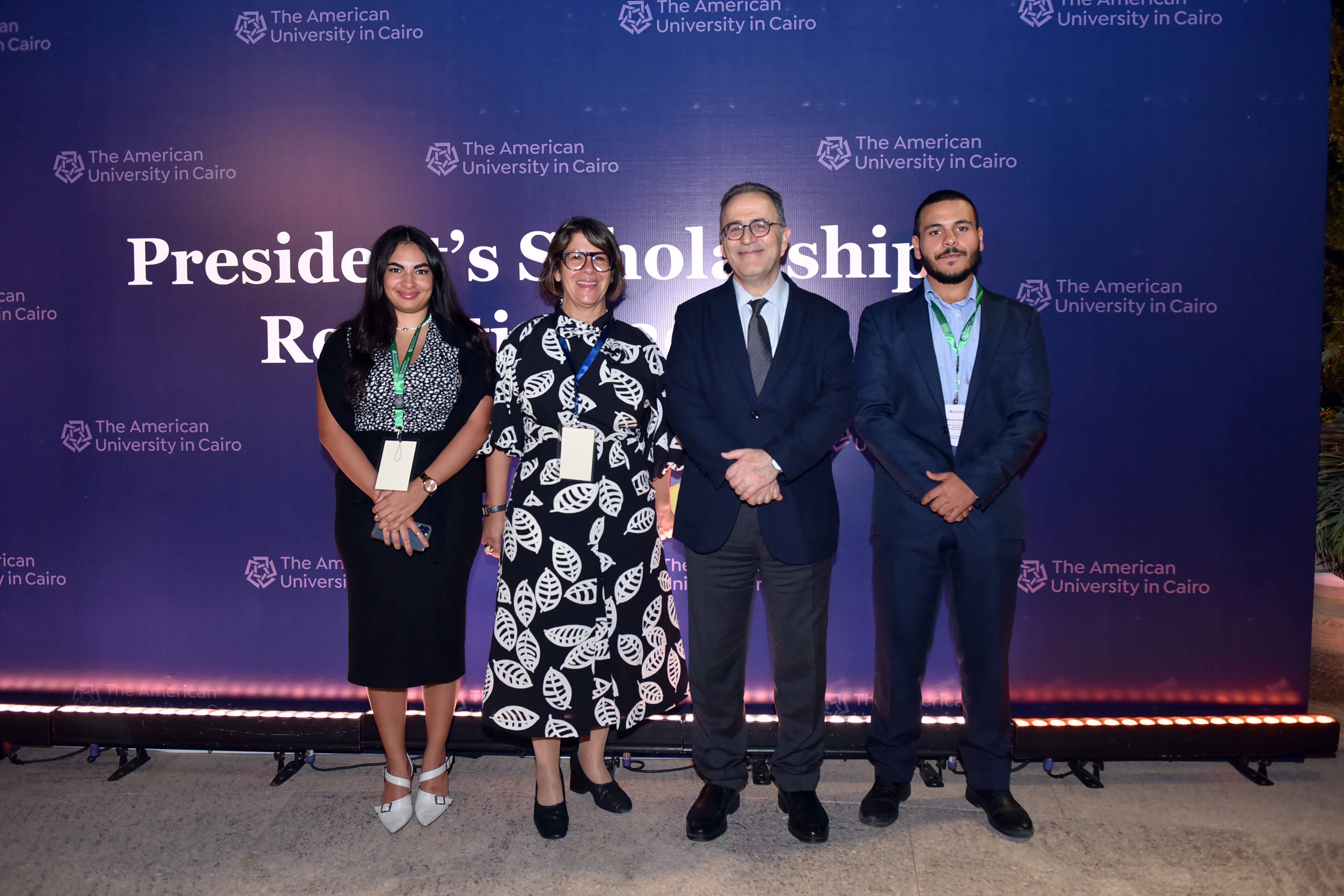 auc president with scholarship students