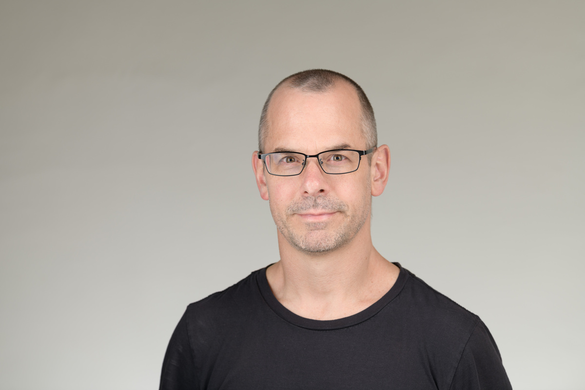 Headshot of a man smiling