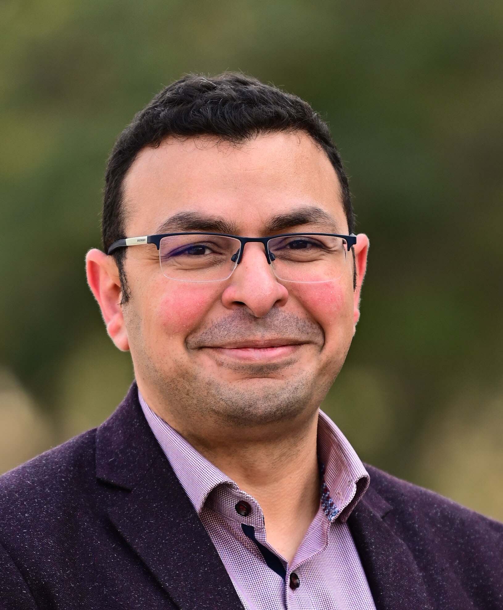 Headshot of a man smiling