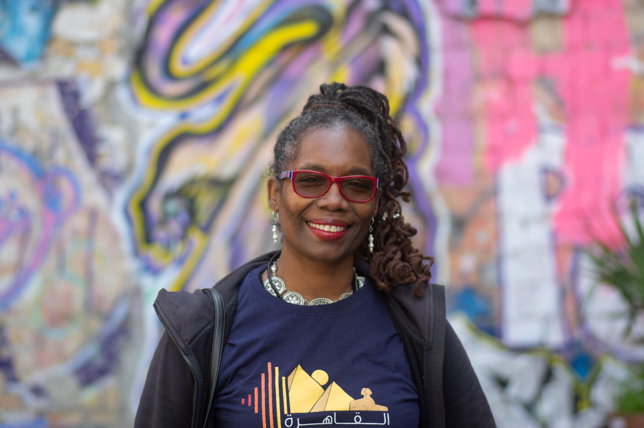 A woman smiling with colorful background