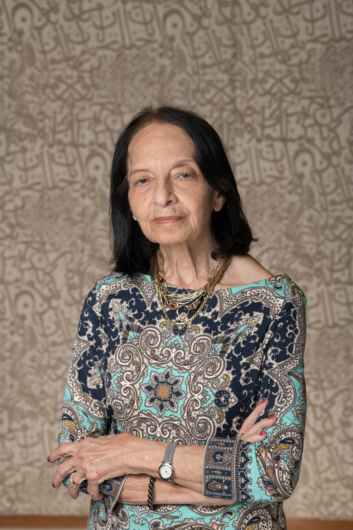 Headshot of a lady standing with her hands crossed