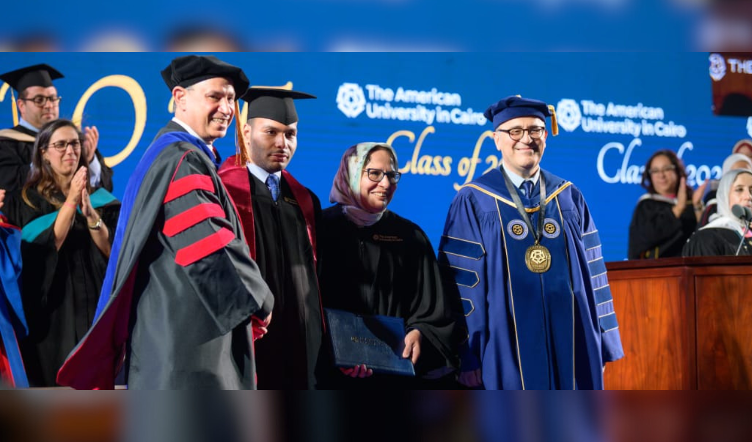 Zaydan family receiving degrees at graduation