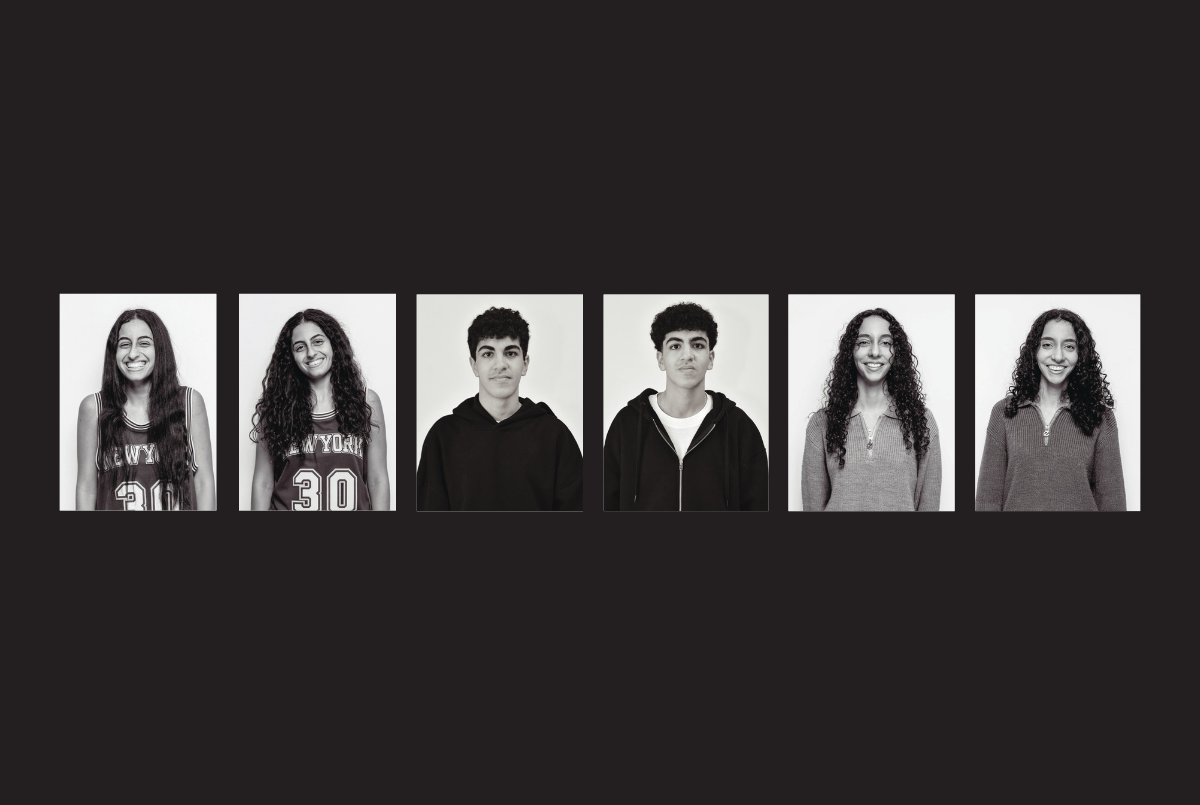 Three sets of twins photographed in black and white on campus, each set of twins is wearing matching tops. 