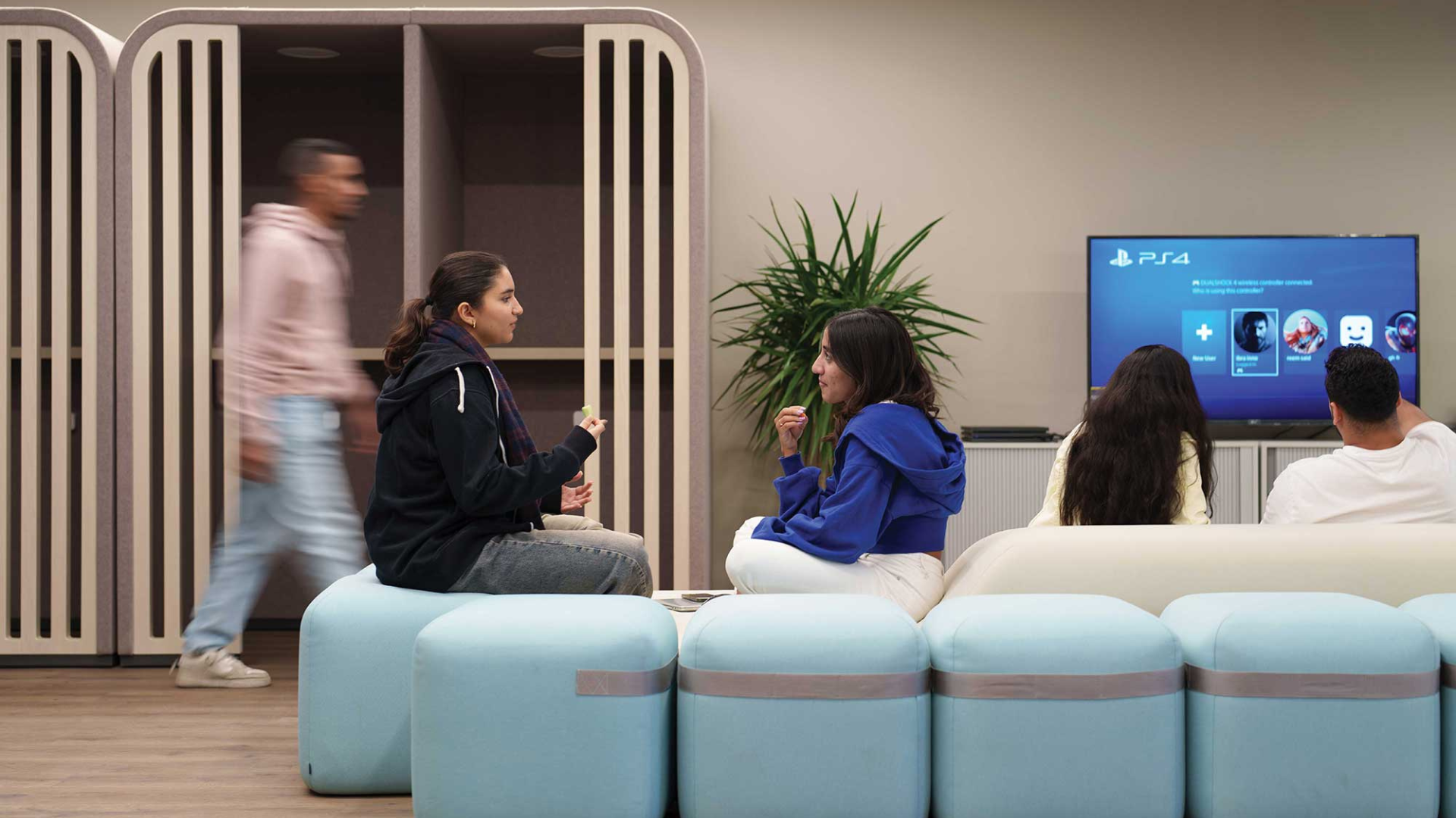 students sitting on a couch in the innovation hub