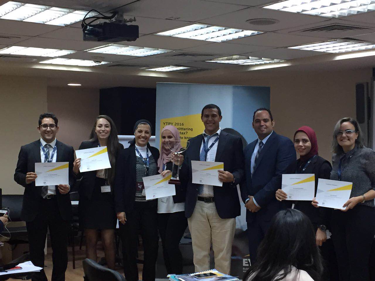 The top six finalists of the competition with HR manager and senior tax analyst at EY