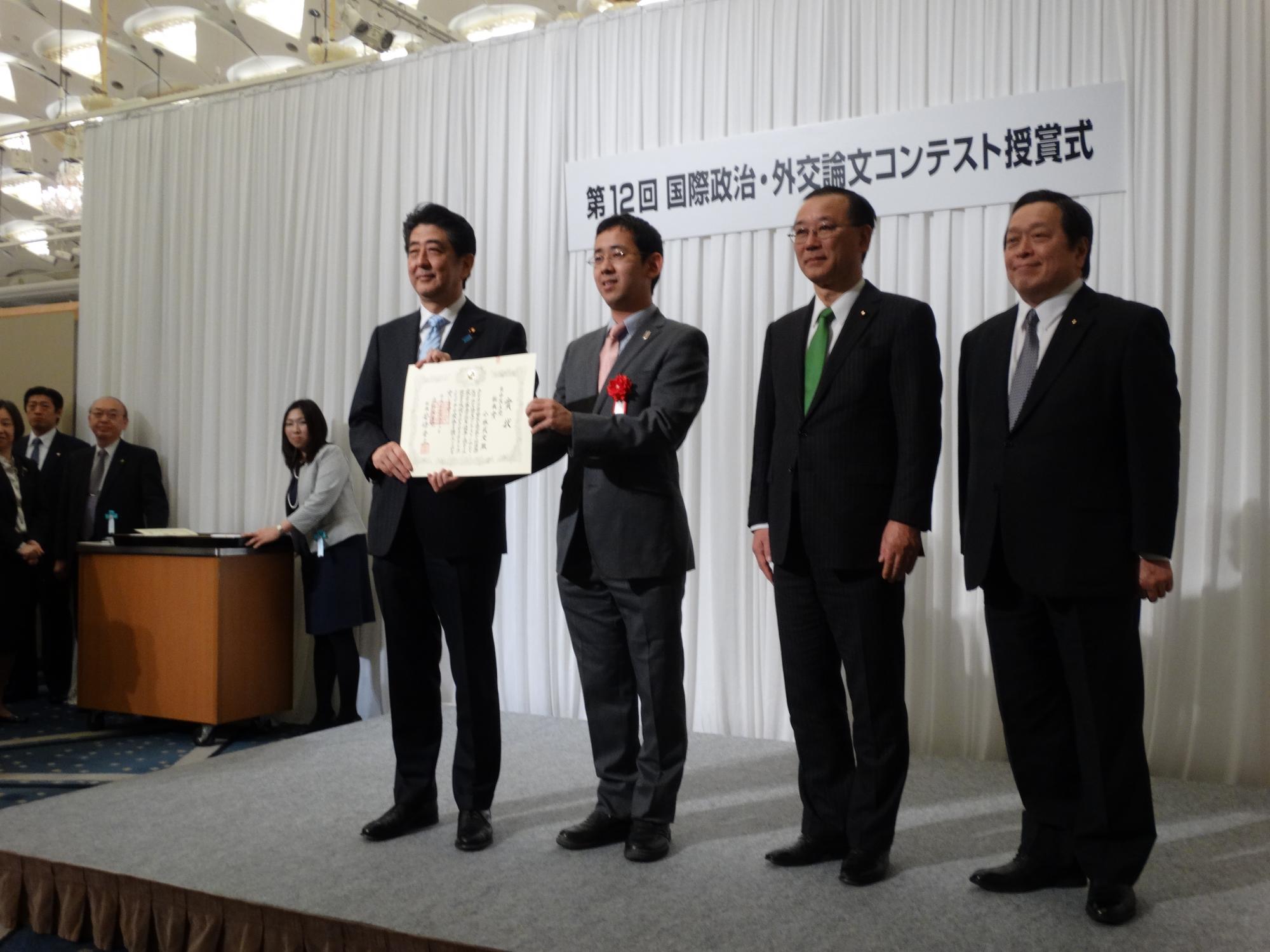 Takeshi Kobayashi awarded by Japanese Prime Minister Shinzō Abe in March for his essay on international relations