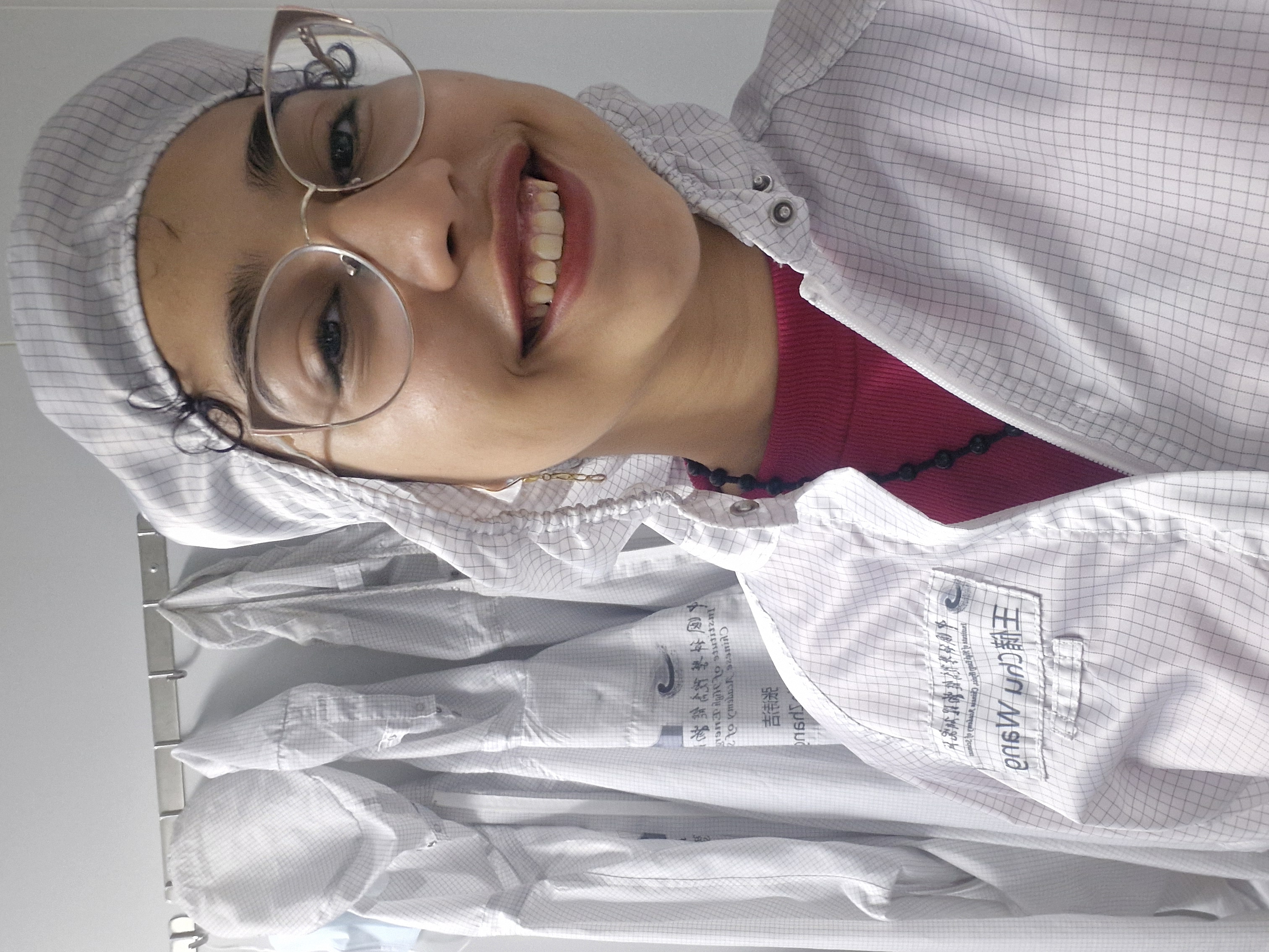 Shahd Younes in her uniform for the hardware room of the Institute of High Energy Physics.