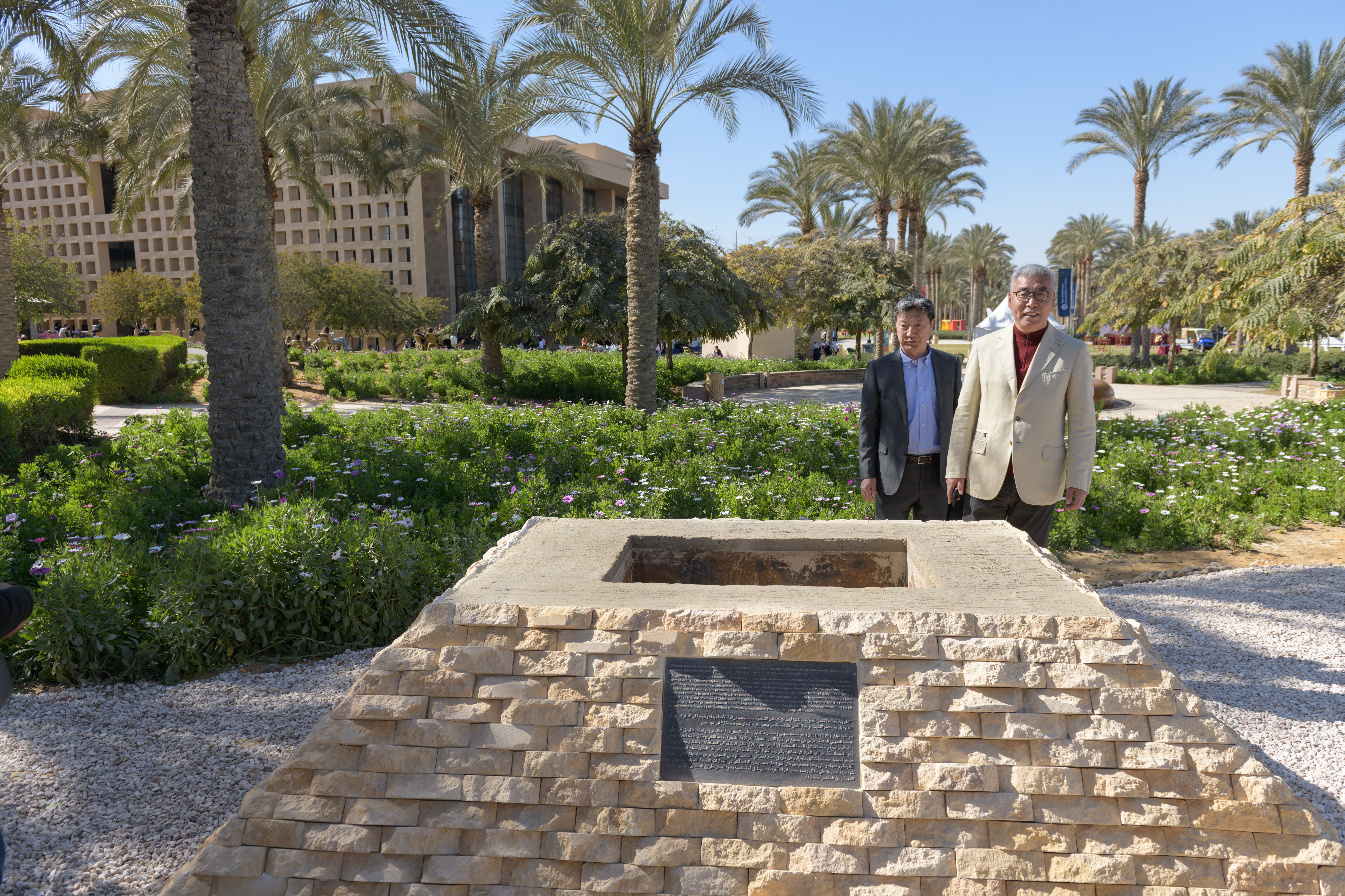 Wei Lu, head of the foundation and son of the celebrated Chinese sculptor Liu Shiming stands on campus where the sculpture will be placed