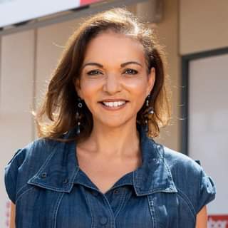 Photo of Anne Aly smiling at the camera