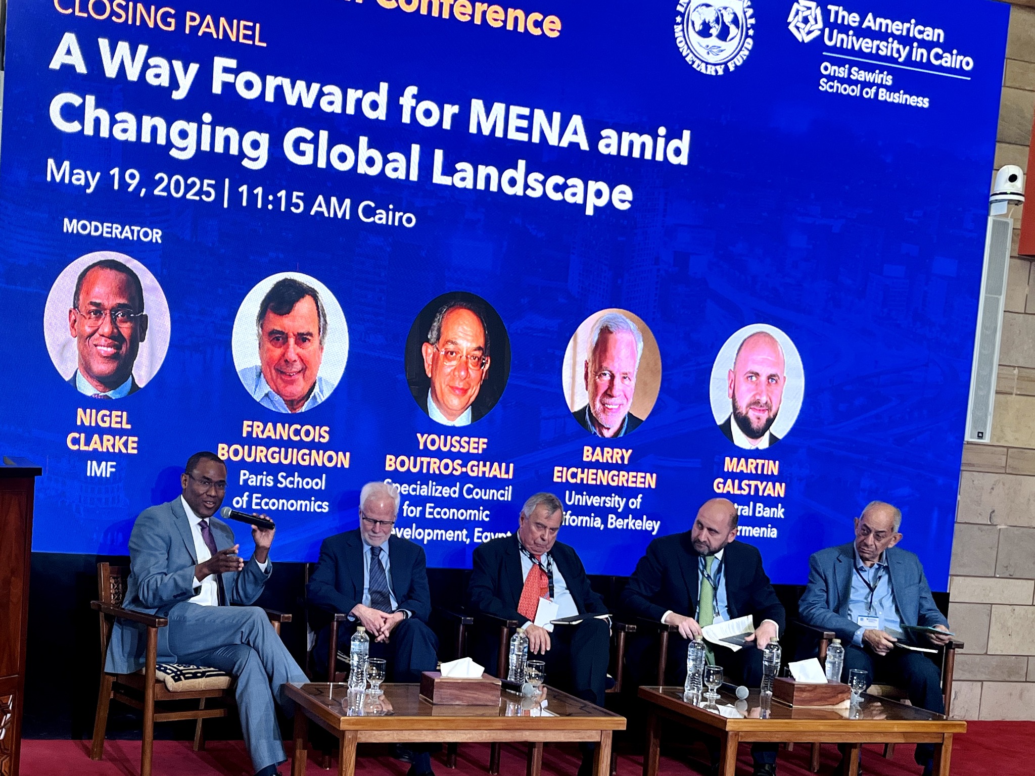 A panel of speakers sitting on stage at the IMF MENA inaugural research conference