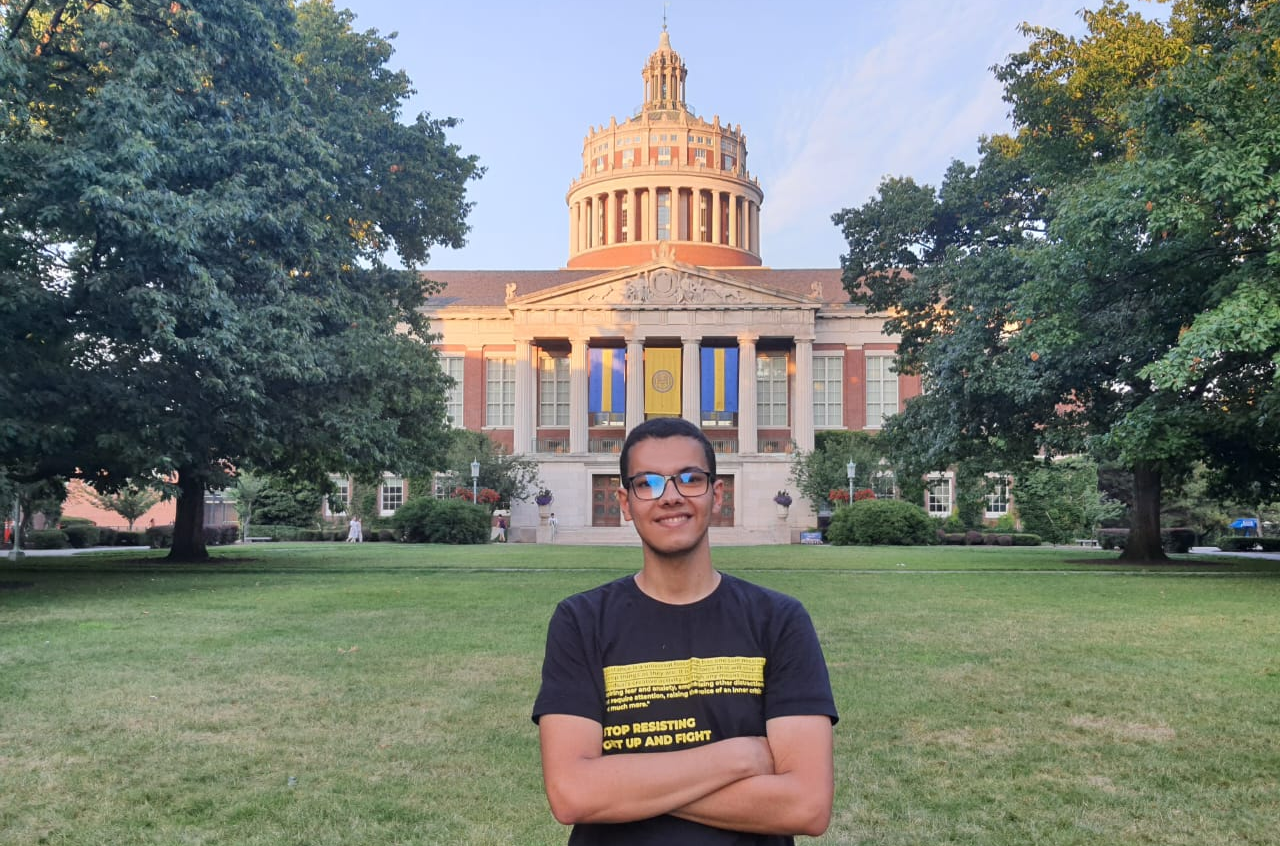 Ahmed Yasser poses in front of campus at the University of Rochester