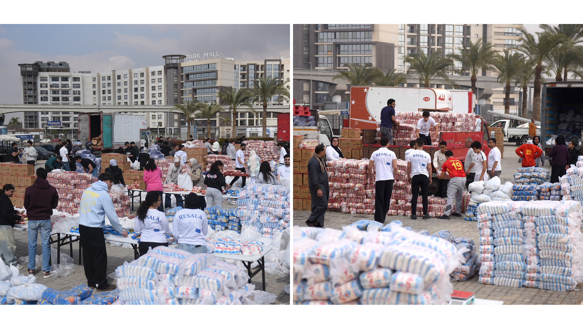 People stand by large pallets of rice and dry goods and boxes