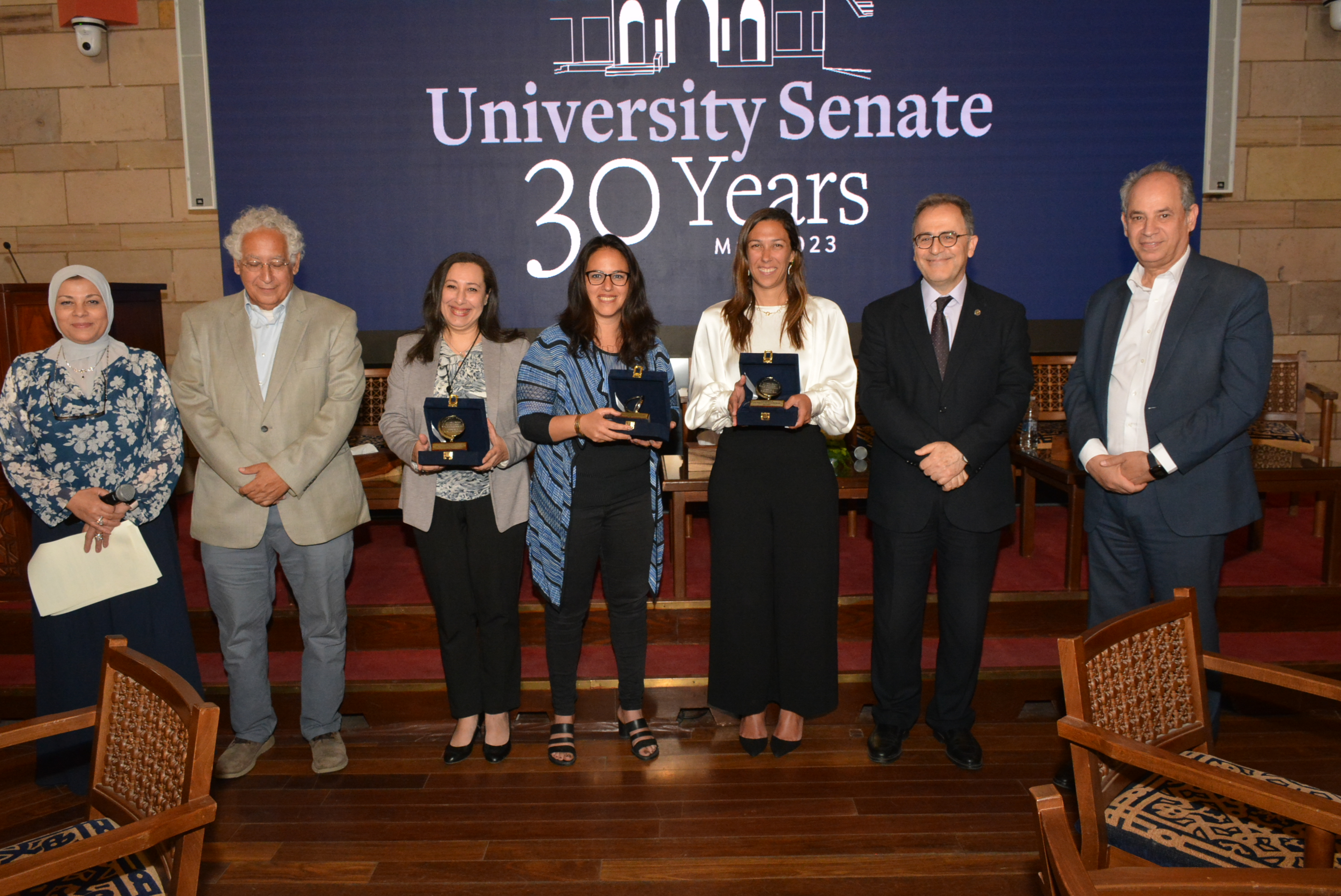 Attendees posing with their awards